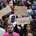 Demonstrators hold signs as they protest against Quebec's proposed Charter of Values in Montreal